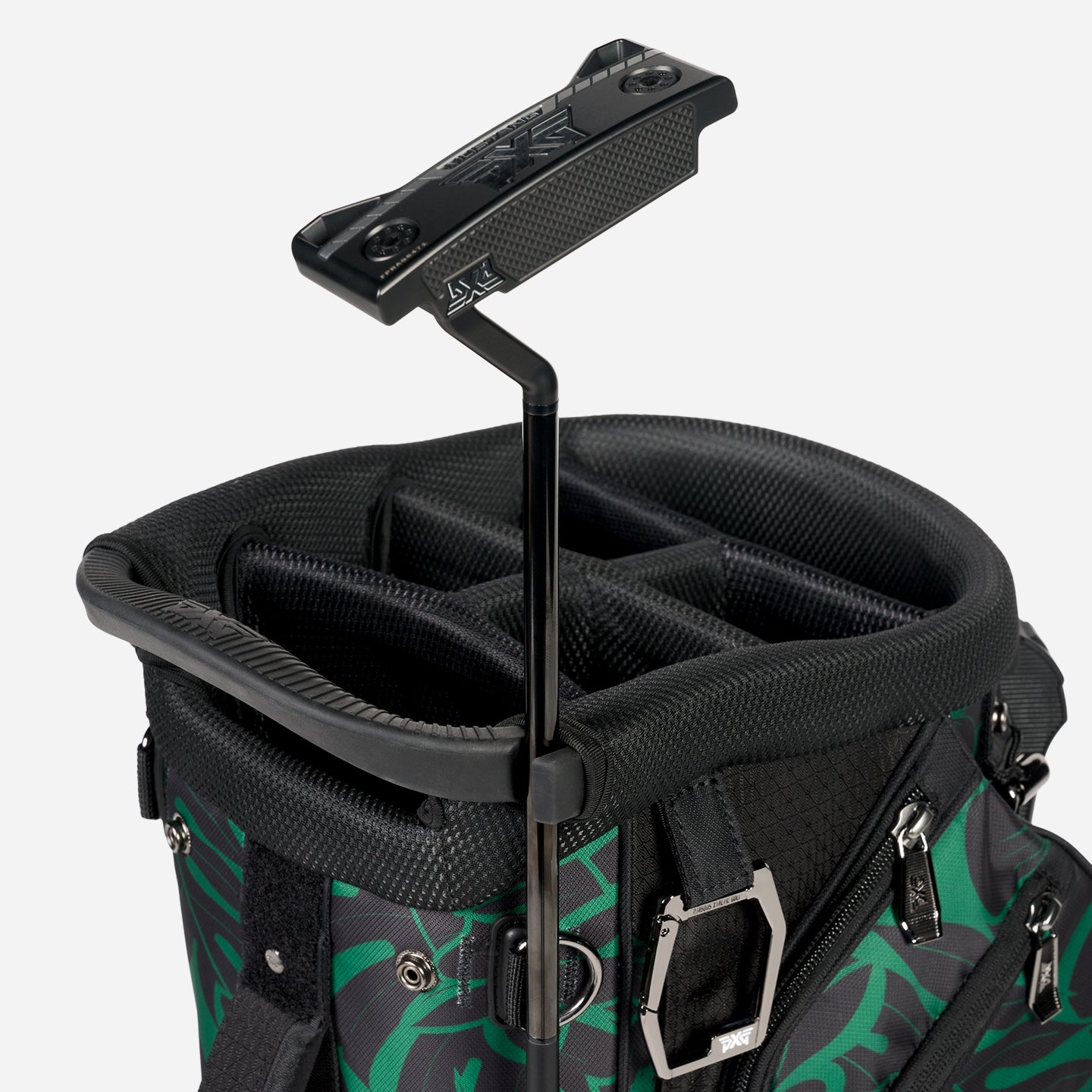 PXG black aloha 2026 hybrid stand golf bag with green and black aloha leaves and flowers pattern on a white background