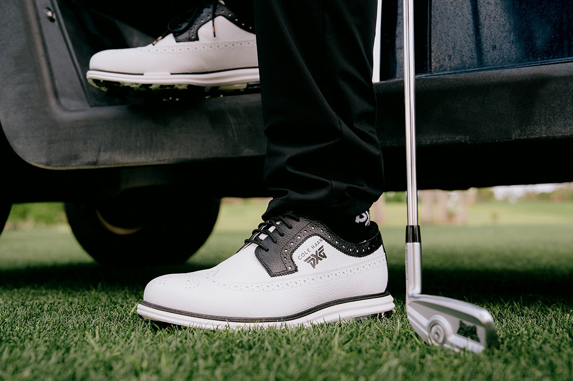 man wearing pxg golf shoes