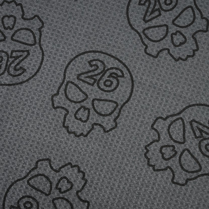 PXG dark gray darkness repeat player's golf towel with repeating skulls on a white background