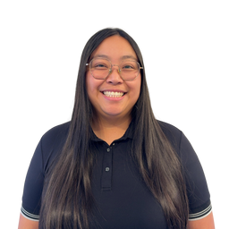 A smiling woman with long dark hair and glasses, wearing a black short-sleeve polo shirt with white stripes on the sleeve cuffs, set against a plain white background.