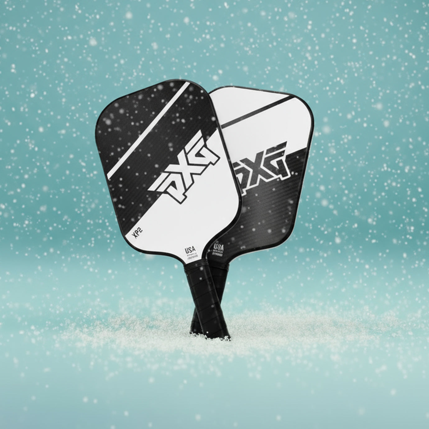 PXG pickleball paddle on a light blue background with snowflake patterns