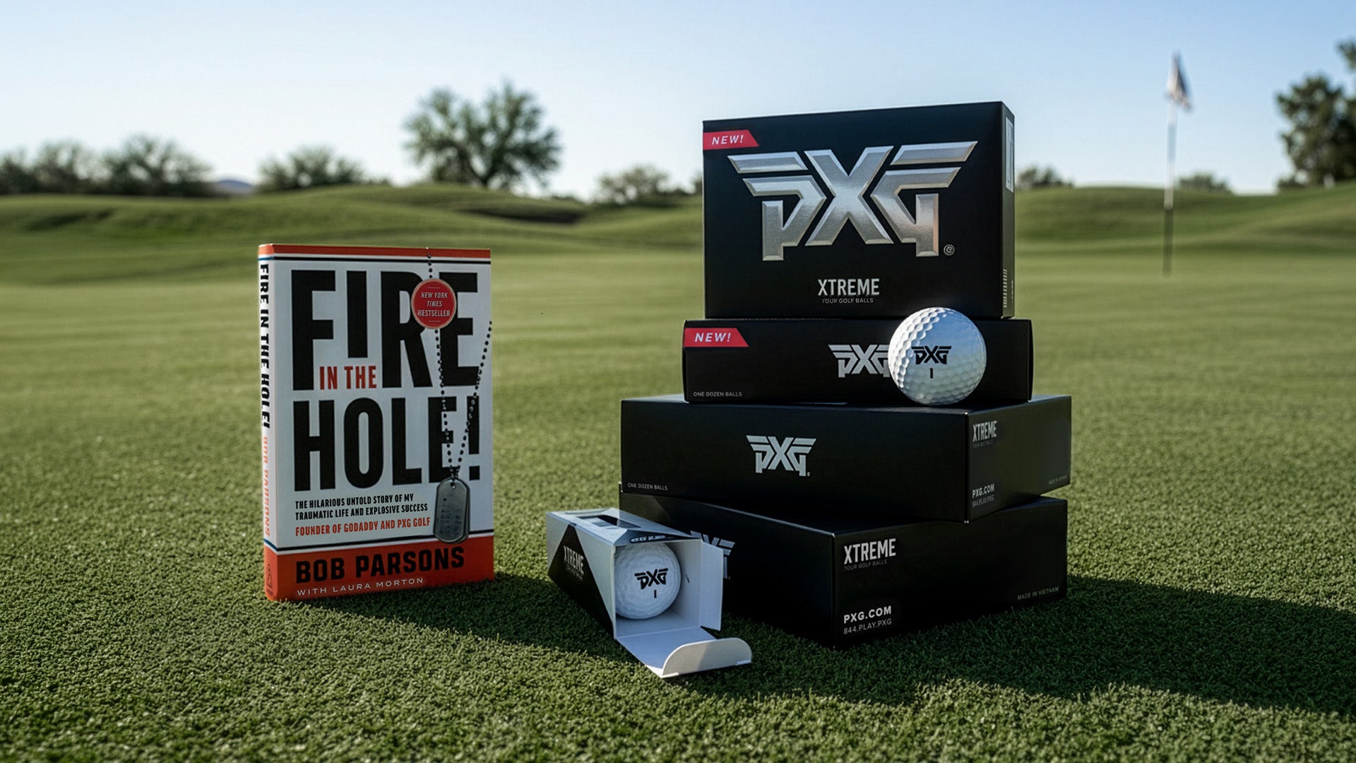 PXG golf balls and packaging on a golf course