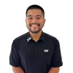 A smiling man with short dark hair and a trimmed beard wearing a black short-sleeve polo shirt with white stripe accents on the collar and shoulders, and a small white chest logo, photographed against a plain white background.