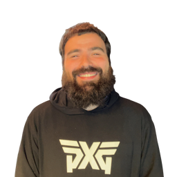 A smiling man with a full beard wearing a black hoodie with a large white 'PXG' logo on the chest, isolated on a white background.