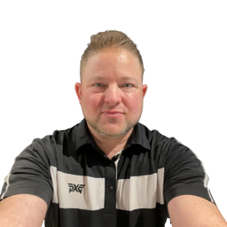 A man wearing a black and white striped short-sleeve polo shirt with a black logo on the left chest, photographed against a solid white background.