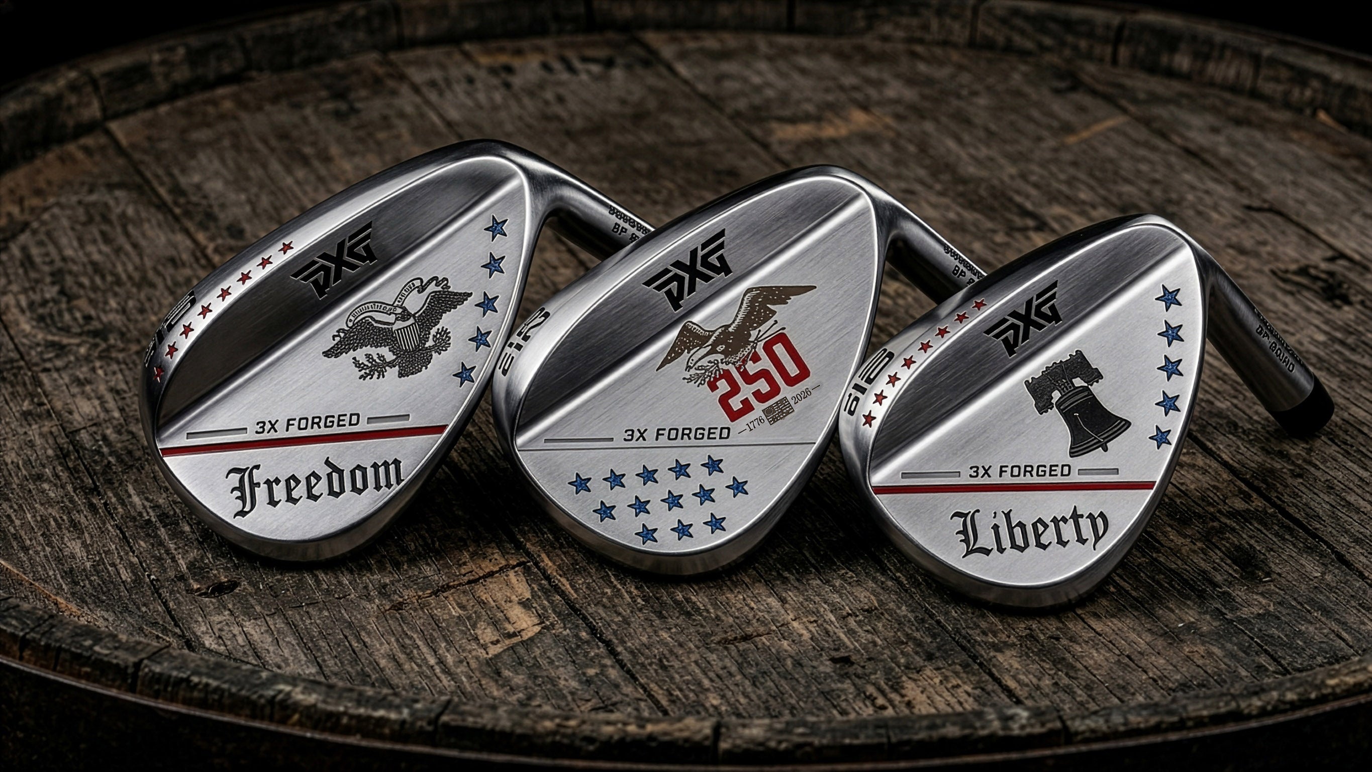 Three golf club heads with 'PXG' branding on a wooden surface