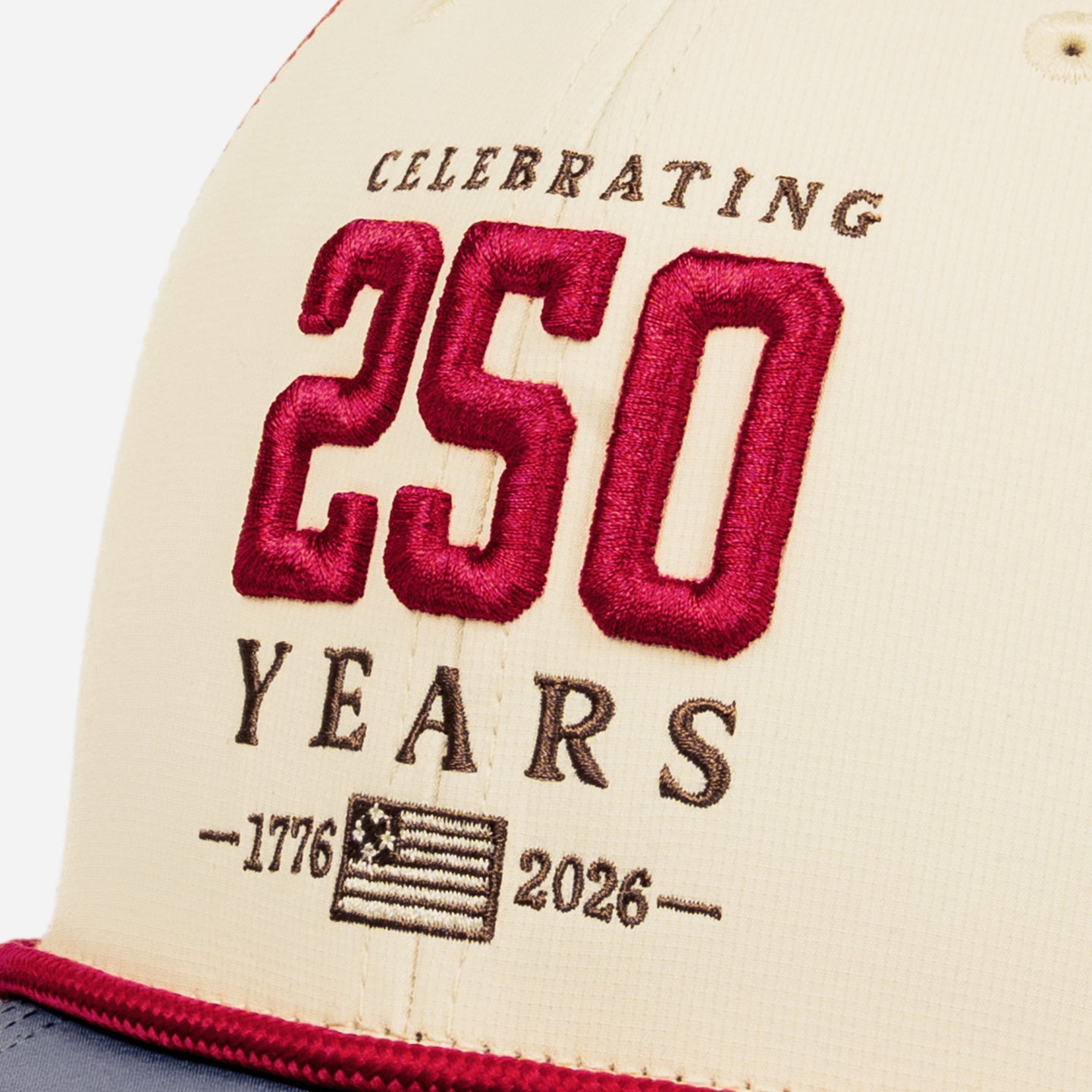 Vintage beige cap with a red 250 on a white background
