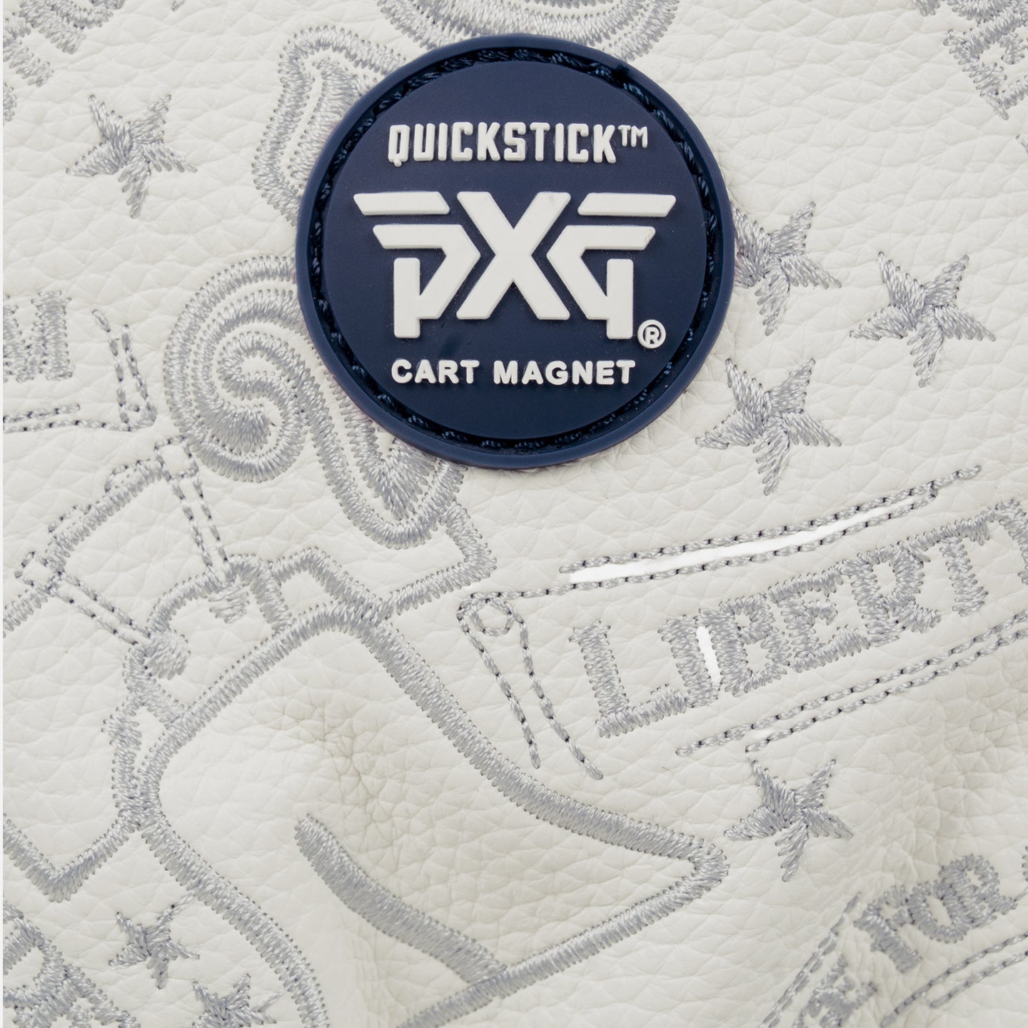 Driver headcover that has white leather decal and a blue pxg logo on a white background