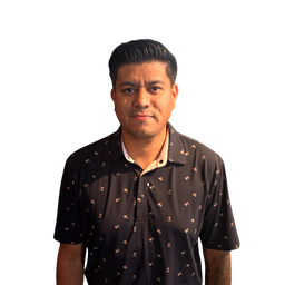 A man wearing a black short-sleeve polo shirt with a small beige and brown floral pattern, set against a plain white background.