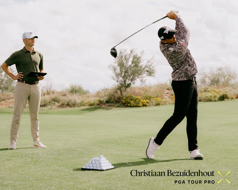 Golfer practicing with a coach on a golf course, featuring Christiaan Bezuidenhout PGA Tour Pro.