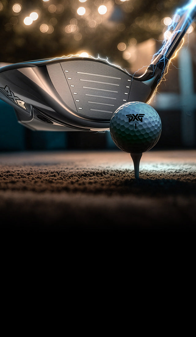 Golf club and ball on a tee with a blurred background