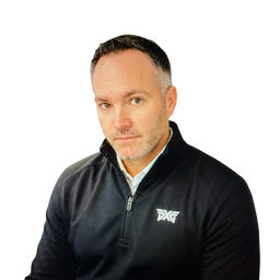 A man wearing a black half-zip pullover with a white PXF logo on the left chest, photographed against a solid white background.