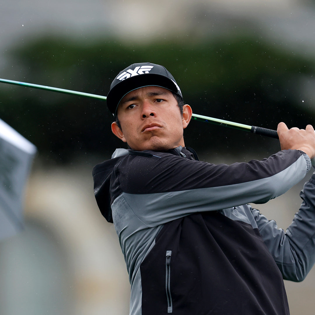 Tour Pro Augusto Nunez wearing a PXG hat swinging a golf club on a golf course.