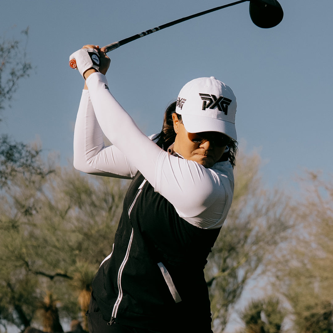 LPGA Tour Pro Auston Kim playing golf with a PXG cap and attire