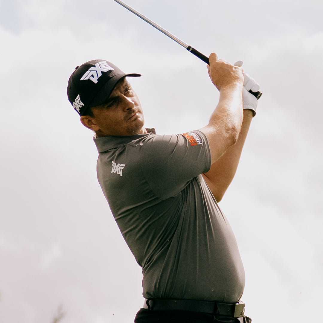 PGA Tour Pro Christiaan Bezuidenhout wearing PXG Golf Clothes against a white sky
