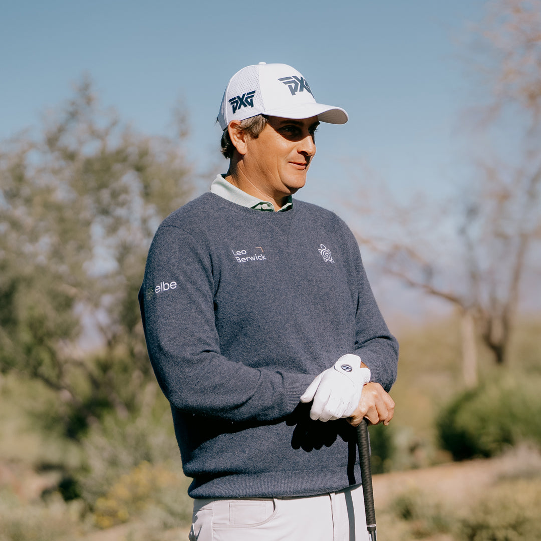 PGA Tour Pro Henrik Norlander wearing PXG Golf Hat on a golf course