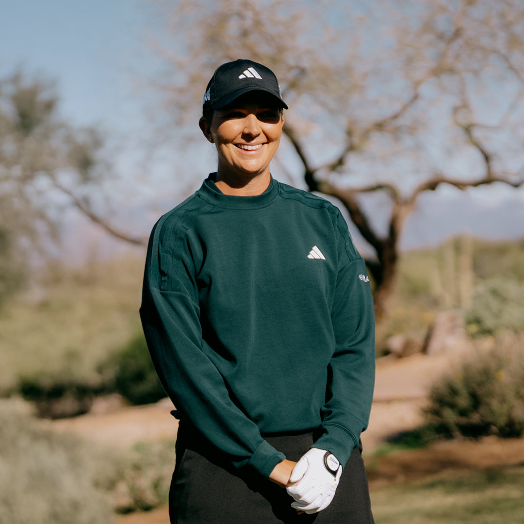 LPGA Tour Pro Linnea Strom smiling on a golf course