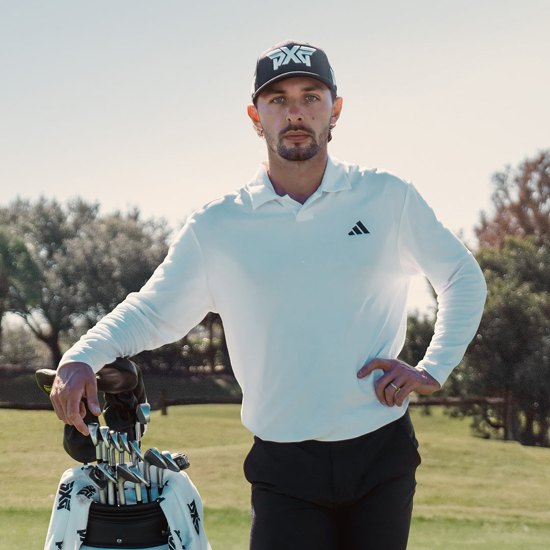 Marco Penge with a pxg golf bag on a golf course.