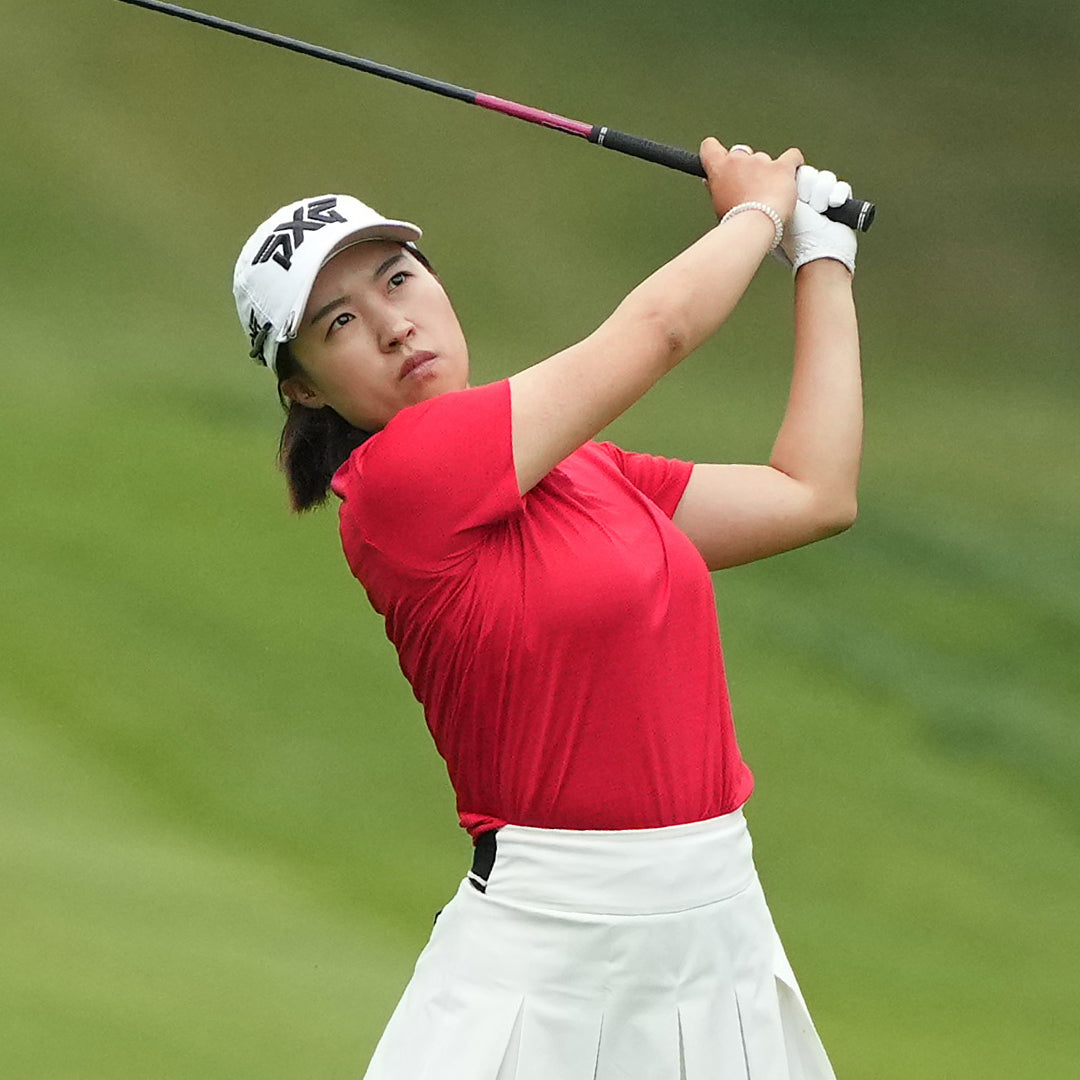 LPGA Tour Pro Minji Kang wearing PXG Golf Hat on a golf course