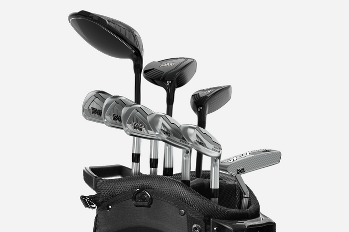 Set of golf clubs in a black bag on a white background