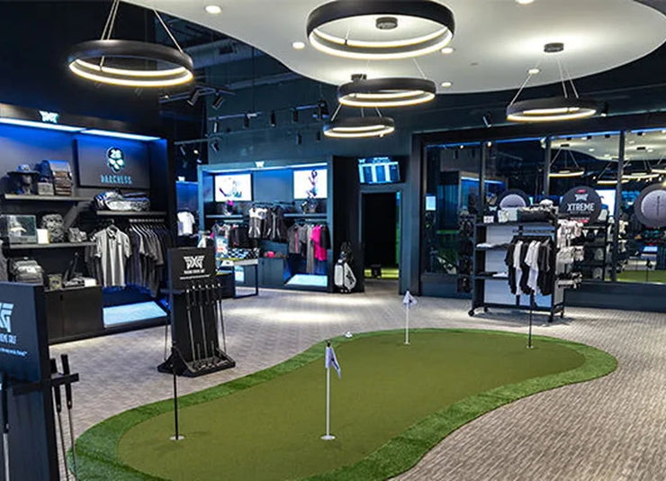 PXG store displays and putting green