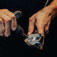 Close-up of an adjustment being made to PXG iron