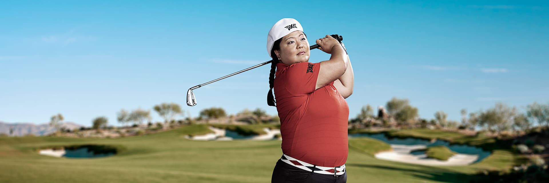 PXG LPGA Tour Pro Christina Kim swinging an iron on course.