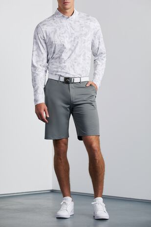 Model wearing white long-sleeved shirt and gray shorts