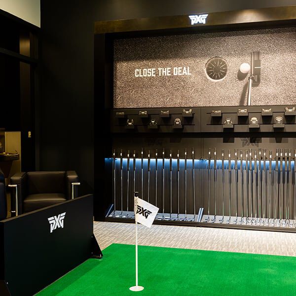 PXG Philadelphia Interior with a fitting bay and a wall of golf shafts.