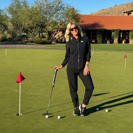 Renee Parsons at green with putter