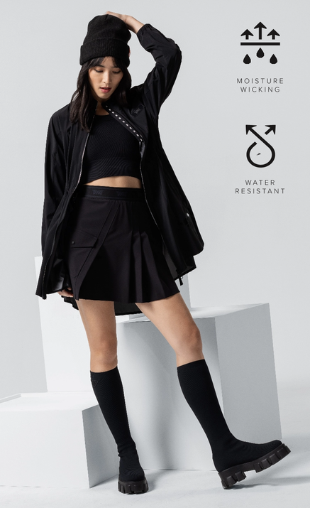 Woman wear new fall 23 arrivals including skirt, jacket and beanie.